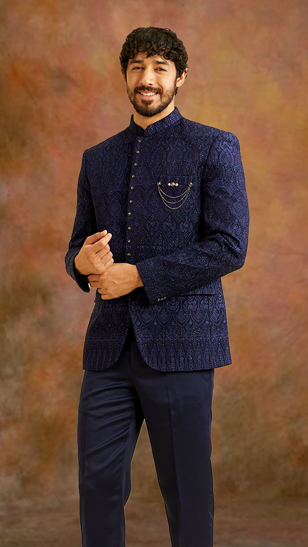 A man in elegant blue jodhpuri suit for wedding season